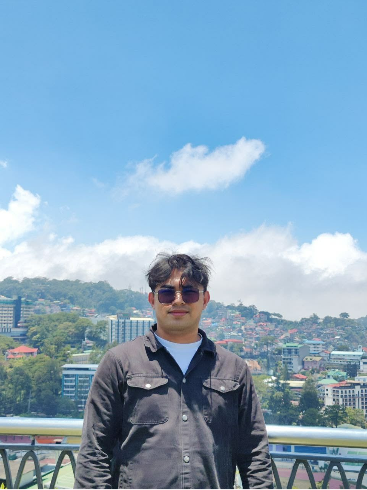 Portrait of Charlie Lahorra standing outdoors during daytime